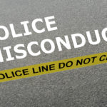 Police misconduct caption behind yellow tape for police line do not cross Police misconduct caption behind yellow tape for police line do not cross
