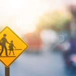 School zone traffic sign with blurred background