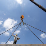 Construction worker with crane hook Construction worker with crane hook