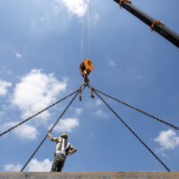 Construction worker with crane hook