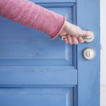 The man opens the door blue The man opens the door blue