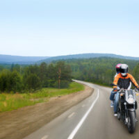 Travel on motorcycle motorcyclist and passenger riding motorbike