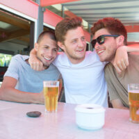 young men drinking beer young men drinking beer