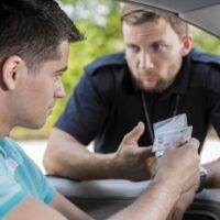 Cop asks man for license