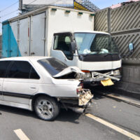 small white truck hits a car