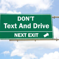 shutterstockgreendon’ttextanddrivesign_590529800