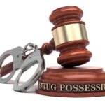 Drug Possession text on sound block & gavel Drug Possession text on sound block & gavel