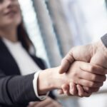 Businesspeople handshake close up view Businesspeople handshake close up view
