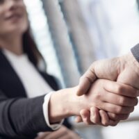 Businesspeople handshake close up view Businesspeople handshake close up view