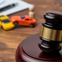 Traffic violation concept by car next to judge hammer Traffic violation concept by car next to judge hammer