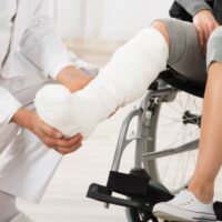 Doctor Examining Leg Of Patient Doctor Examining Leg Of Patient