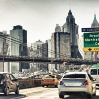 Cars speeding up in FDR Drive in New York. View from car interio Cars speeding up in FDR Drive in New York. View from car interio
