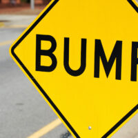 close up on bump sign at the side of street close up on bump sign at the side of street