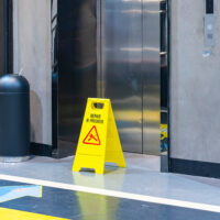 repair in progress sign near an lift, warning sign lift under repair