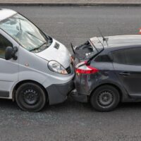 Auto accident involving two cars on a city street