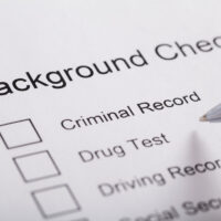 Close-up Of Pen Over Background Check Form