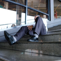 A man falls down the stairs and is injured.